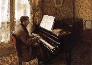 The young man plays the piano